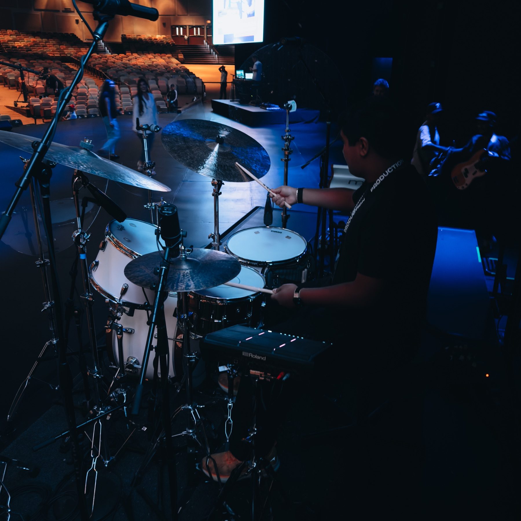 Gerson Hernandez playing drums during church production